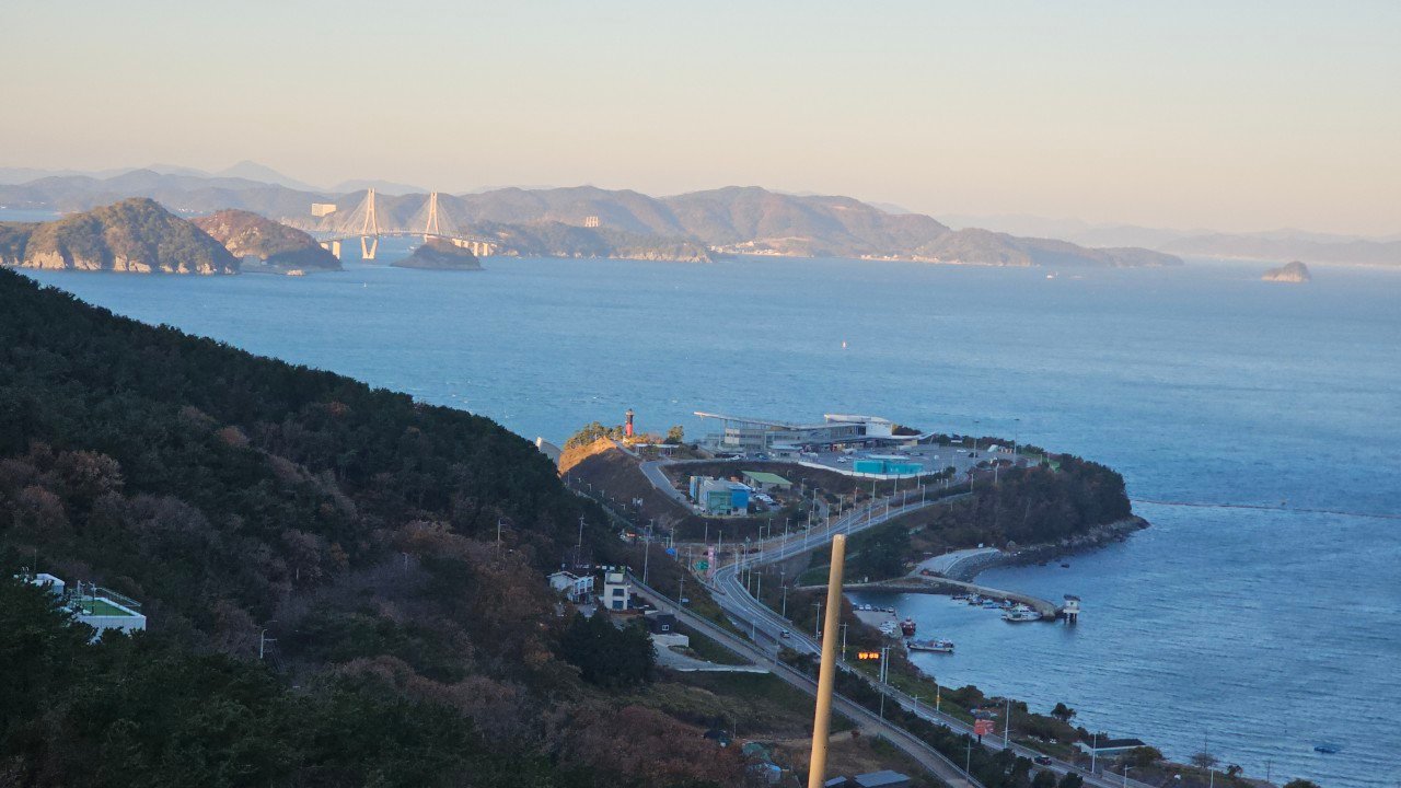 View of Geoga Bridge and the coastline from the Gamnaetgil Course 5-3 ridge on Gadeokdo Island, Busan